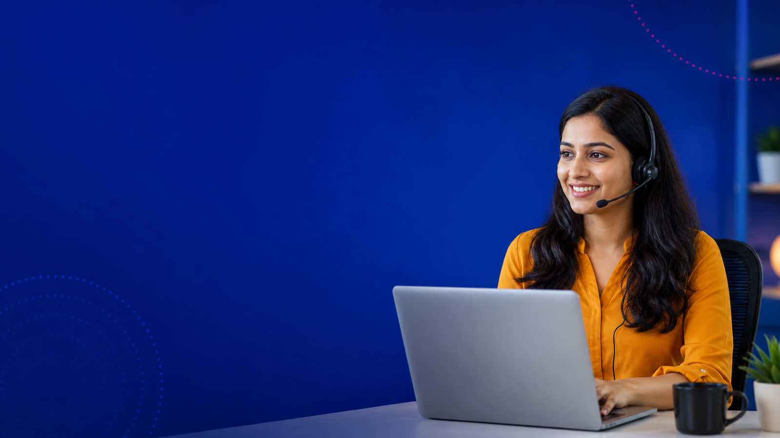 Support agent wearing a headset and working on a laptop preview image