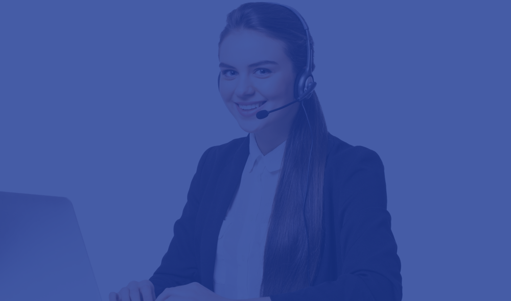 Support agent wearing a headset and working on a laptop